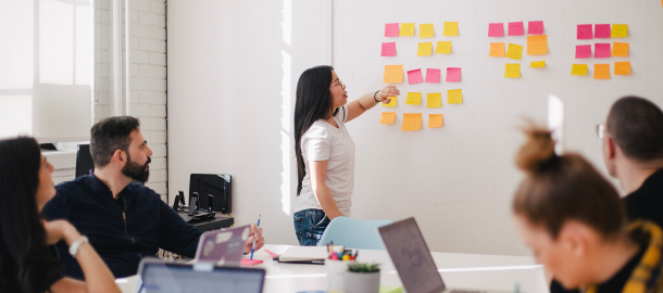 woman presenting sticky notes