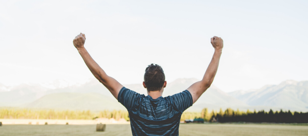 man with arms in the air